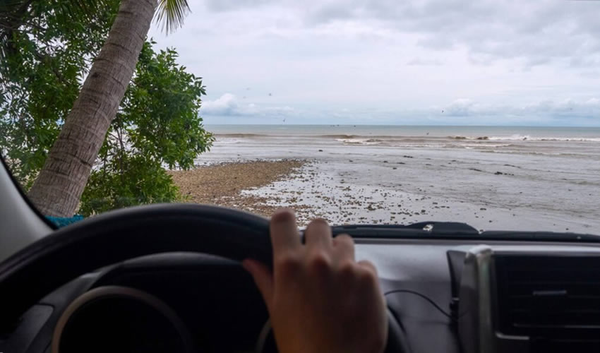 Scenic road with a car driving in Costa Rica